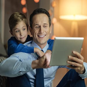 Father and son looking at tablet for estate planning law